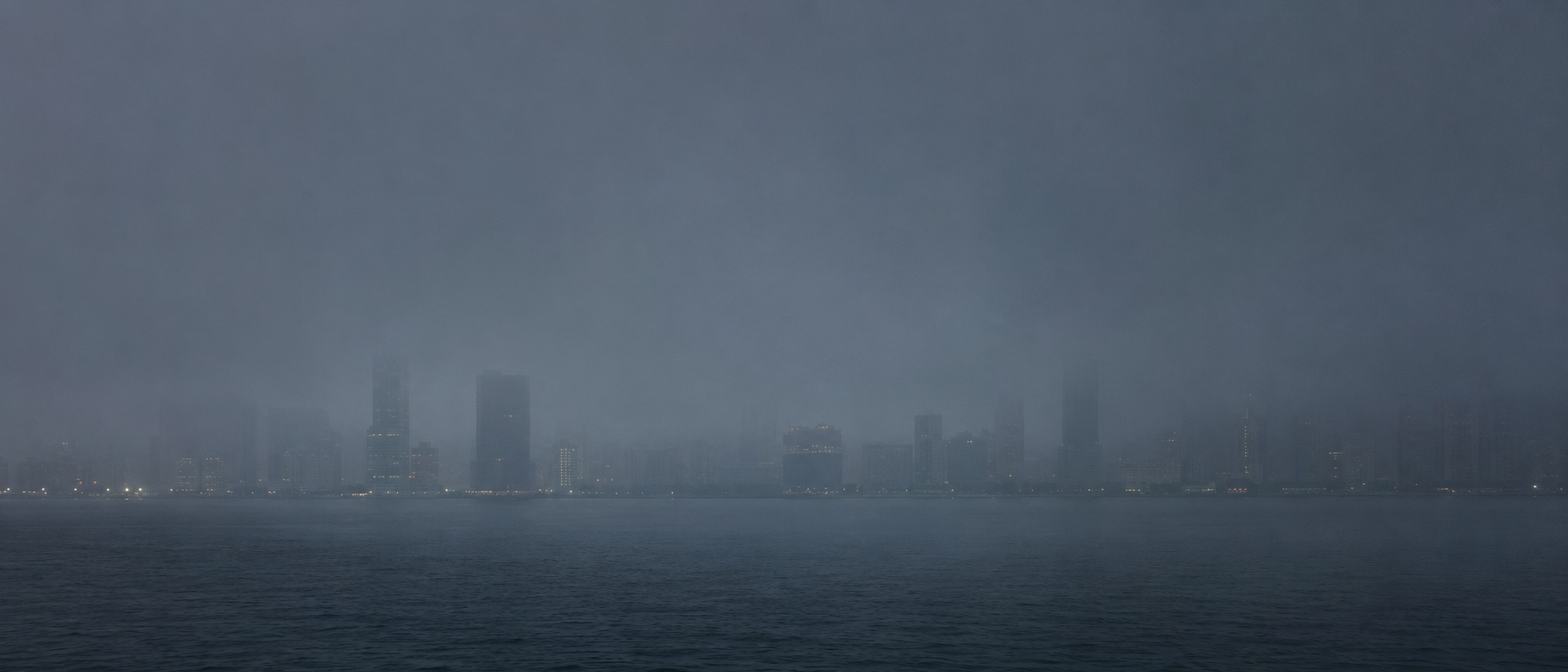 A Far Eastern harbour skyline in fog