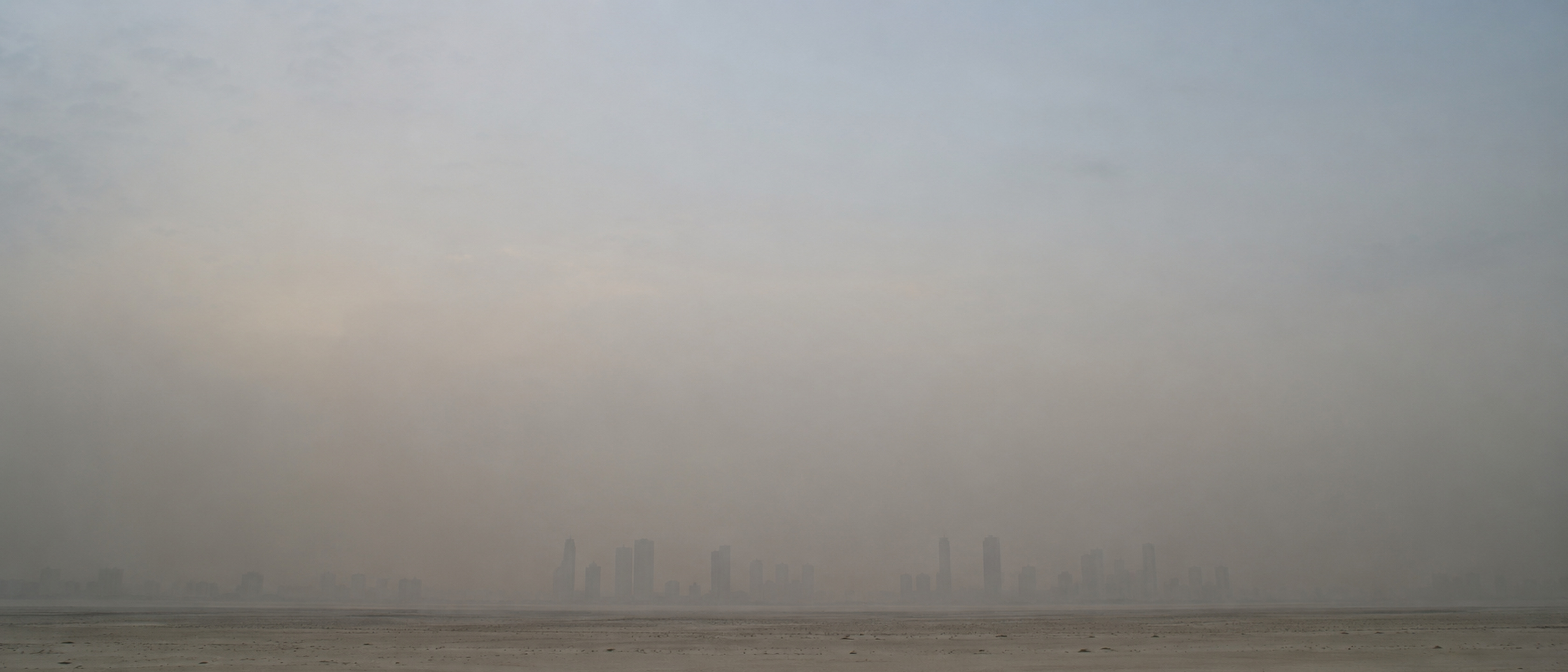 The Gulf skyline through desert haze